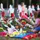 People visit a makeshift memorial setup in front of Marjory Stoneman Douglas High School in Parkland, Florida. (Photo: Getty)